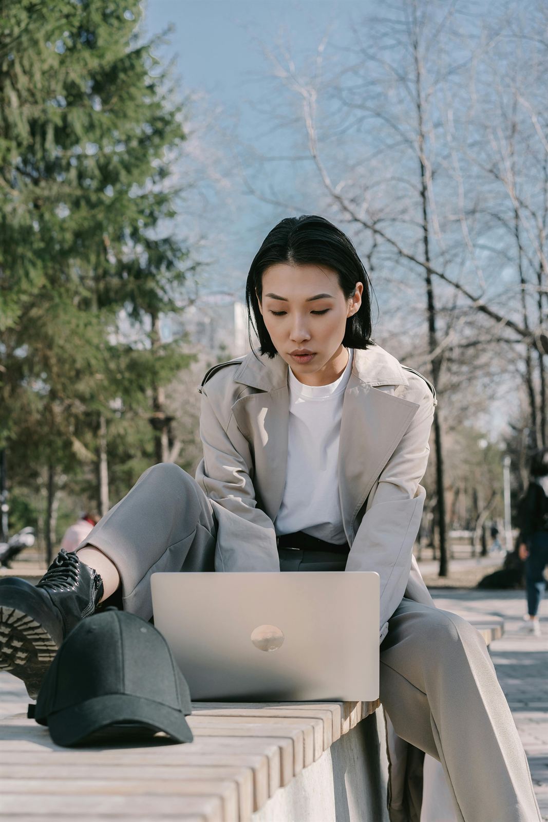 A professional learning independently on a laptop in the open air