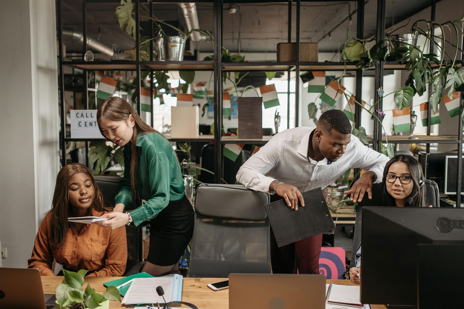 A manager monitoring staff in an office