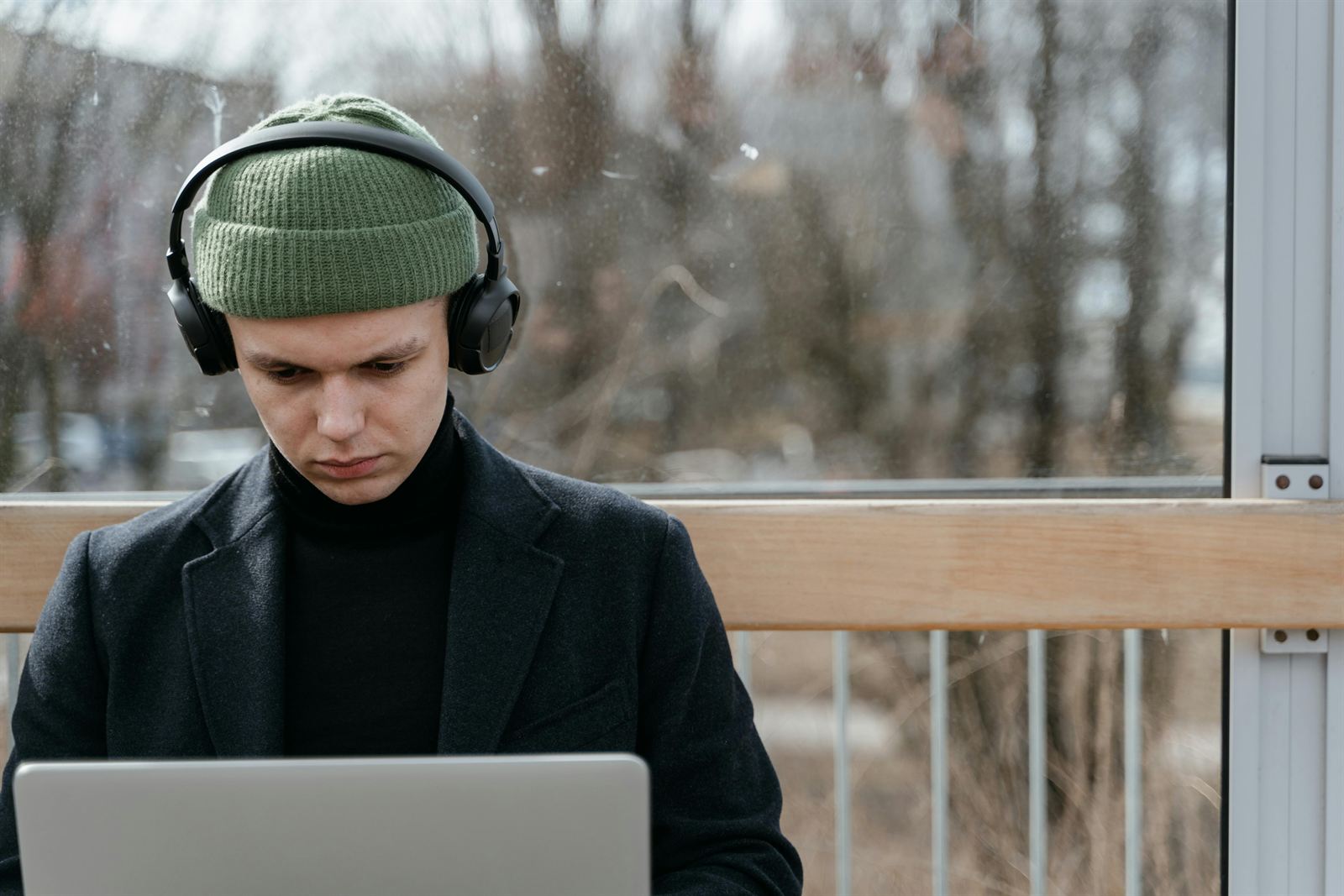 A person working with focus, wearing headphones